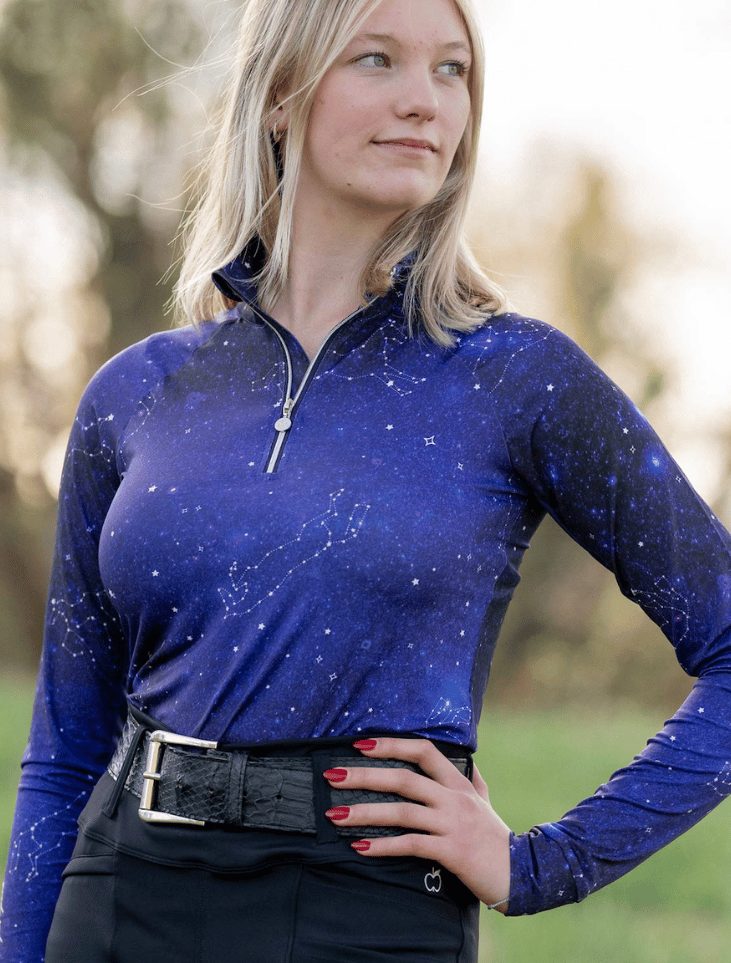 A rider in a navy Dapplebay Constellation top
