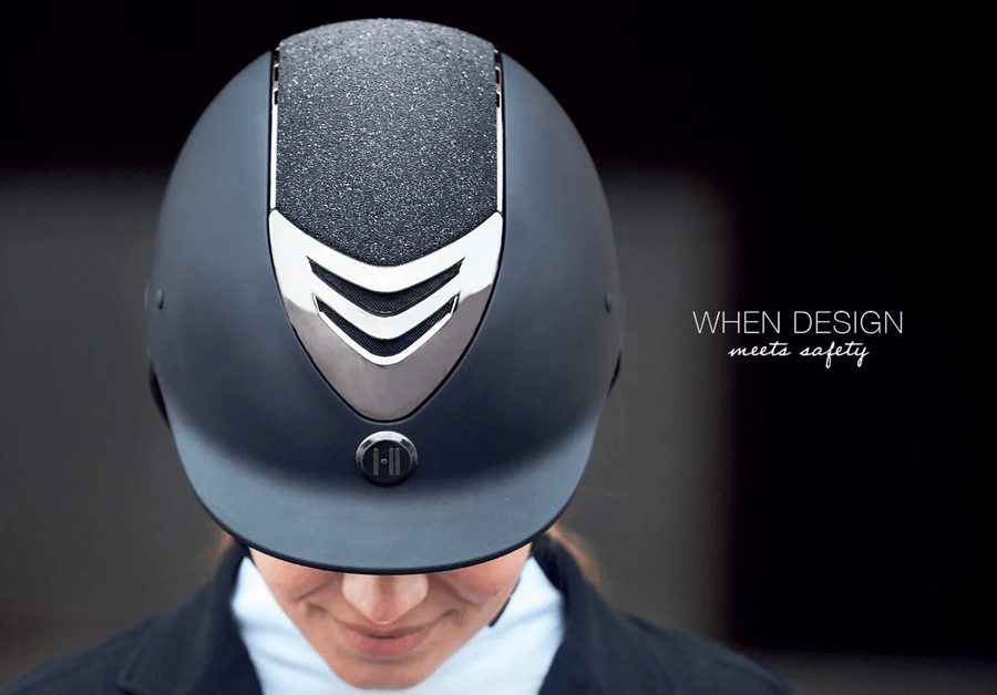 A rider looking down to show the glitter top panel and chrome front shield of her One K CCS helmet