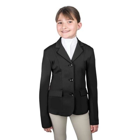 A smiling young rider in a black Ovation PowerFlex Lite show coat