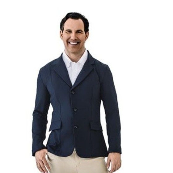 A smiling rider in a navy Ovation PowerFlex Light show coat