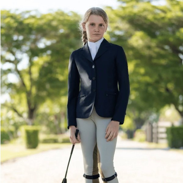 A young rider in a show coat